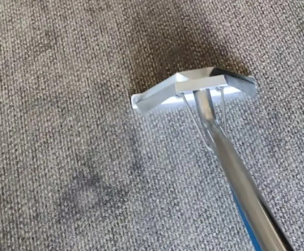 Vacuum cleaning a dirty carpet