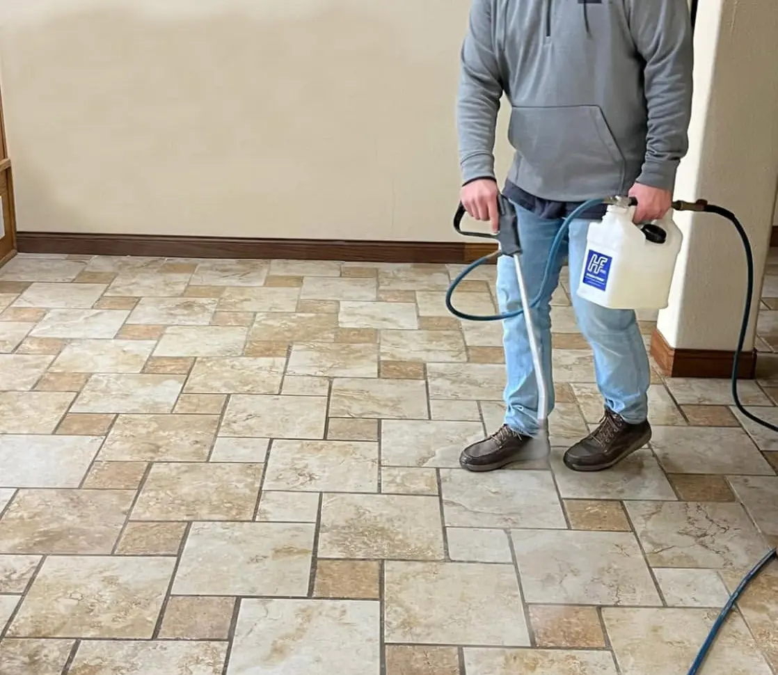Xtreme Restoration cleaning tiles in a commercial office