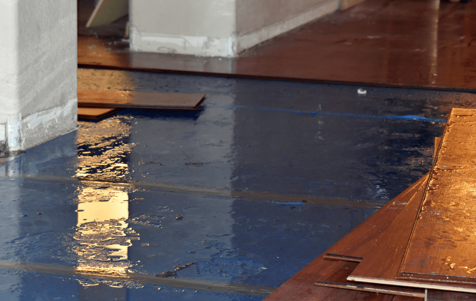 Water Damage Clean Up Home with floor boards pulled up due to water damage